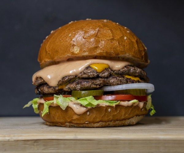 A burger with lettuce, tomato, and a toasted bun